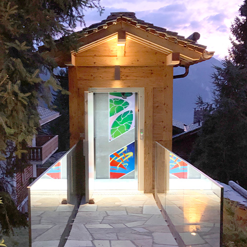 graffitism style mural painting inside a private lift in a swiss chalet