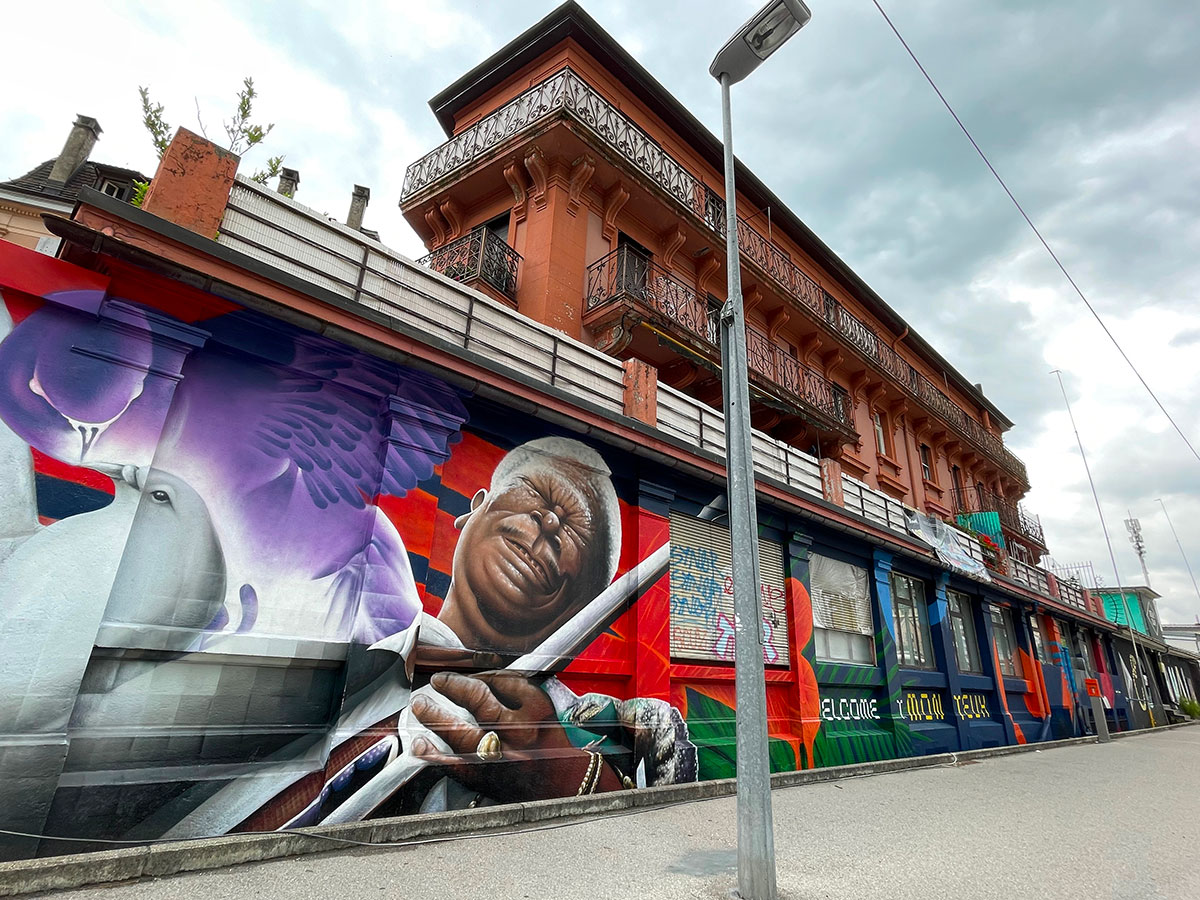 vibrant mural painting over a classified building to repress vandalism / left side