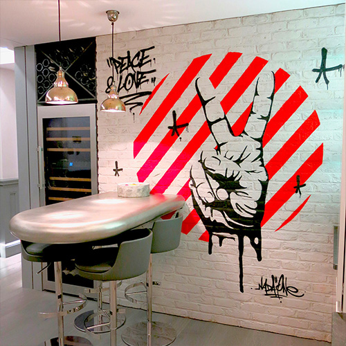 2 colors stencil on a white painted bricks wall in London